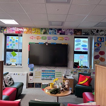 classroom with a large tv on the wall