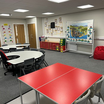 different working tables and a whiteboard at the front