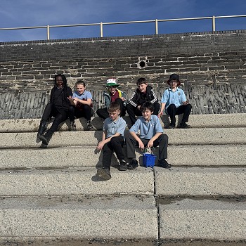 students sitting on the each steps