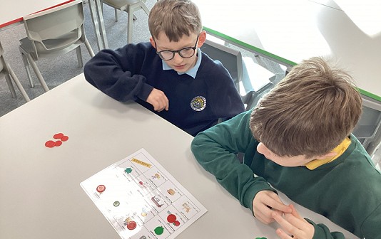2 students playing a welsh educational game